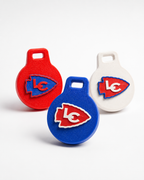 Three round Airtags in red, blue, and white, each featuring a raised Lakeland Chiefs arrowhead logo with the letters LC, photographed on a clean white background.